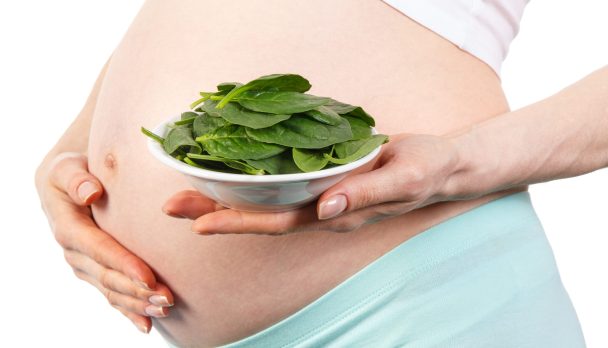 Pregnant,Woman,With,Portion,Of,Fresh,Green,Spinach,,Concept,Of